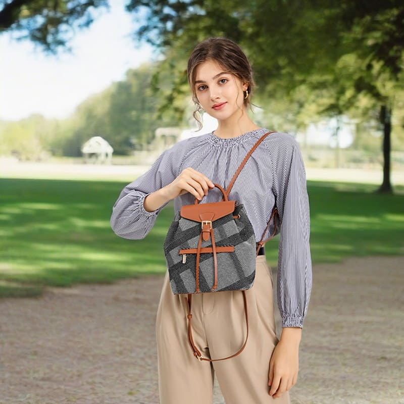 A female model presents a brown cotton and linen women's daily glamour women's backpack upper body effect product image2