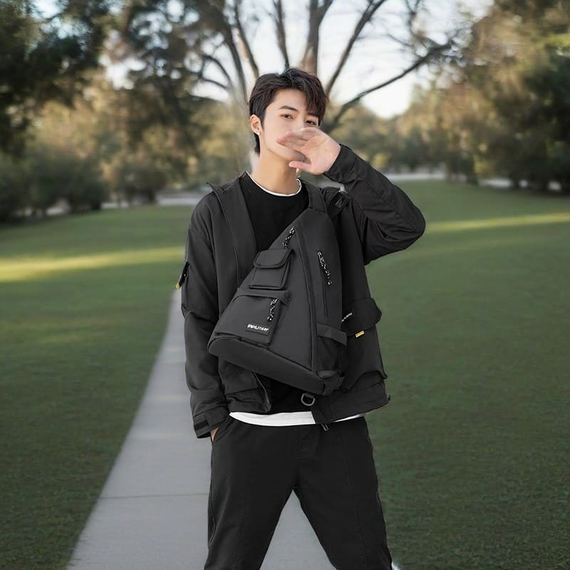 A male model shows the effect of a daily waterproof Oxford breast bag & Hipster lightweight shoulder bag