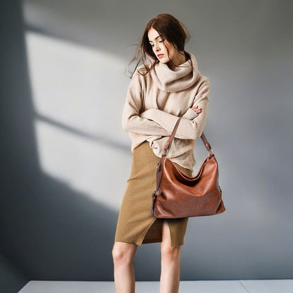 A model show off the brown Elegant Women Retro Handbag vintage Tote Satchels Shoulder Hobo Bag