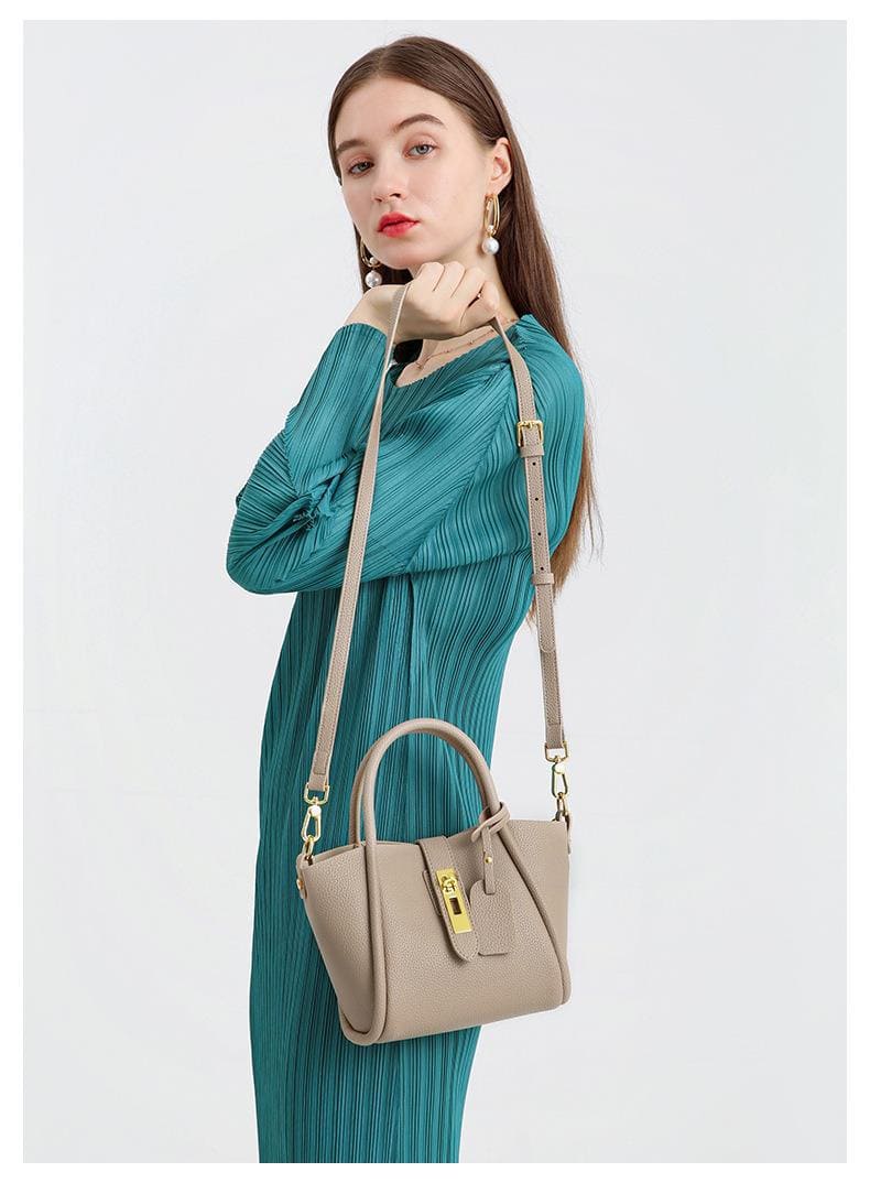A female model shows the upper body effect of this classic cowhide leather casual tote bag for women crossbody bag.3