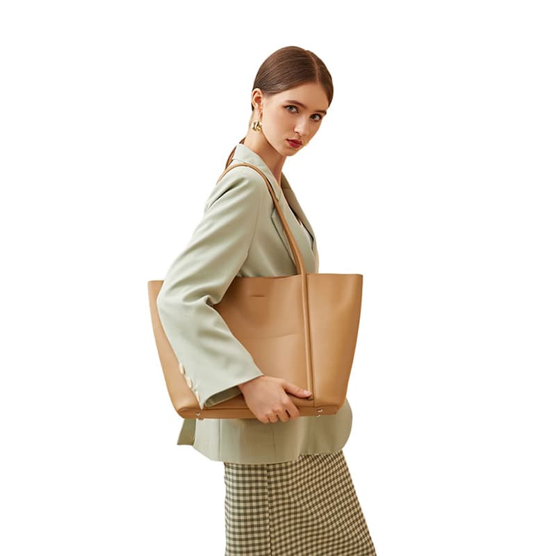 A model showcases khaki real cowhide leather tote for the upper body effect of women's large capacity tote